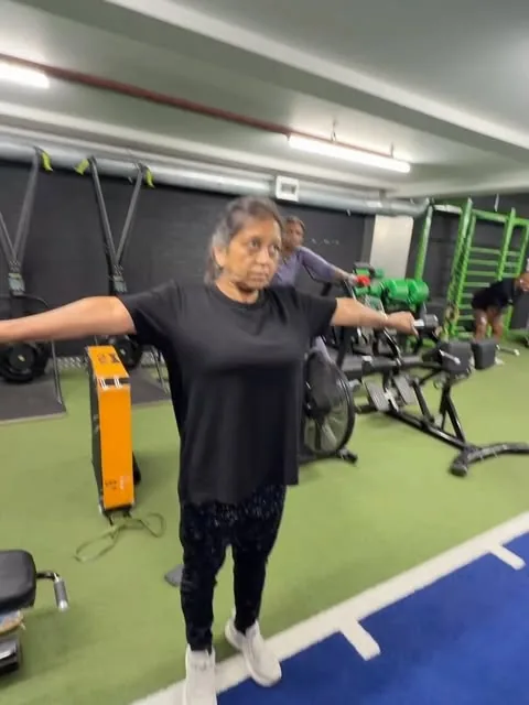 Post: a client working through a mobility drill on the gym floor